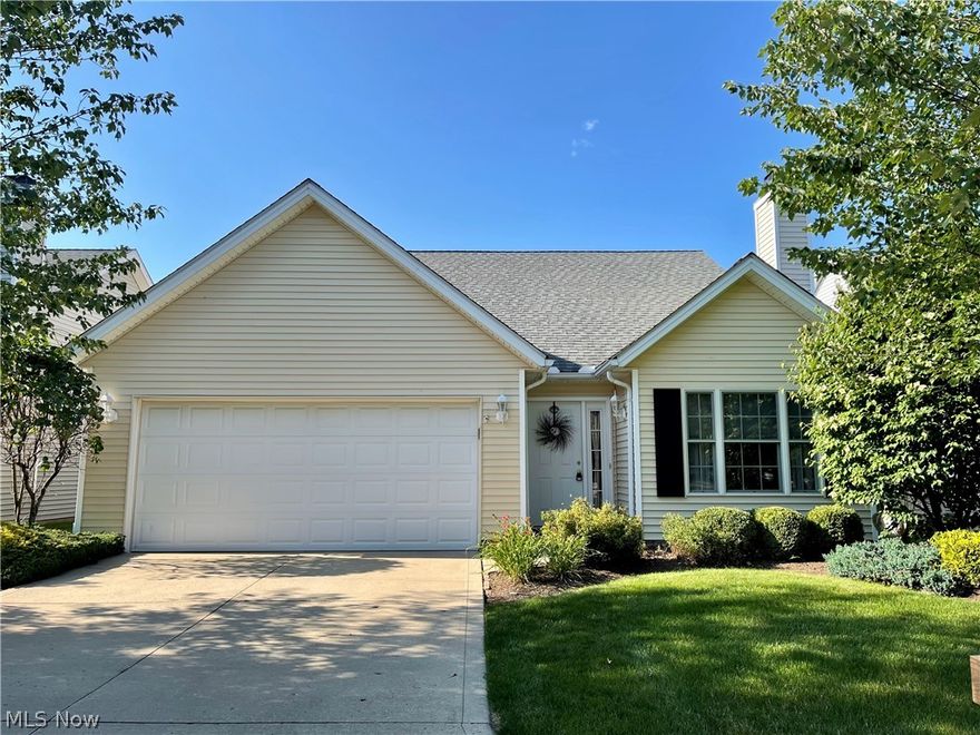 This beautiful free standing updated condo welcomes you in with its open floor plan.  The moment you enter the front door you will experience the warm, welcoming colors and decor.  This home features all the bonuses of two story living with first floor amenities of a master bedroom/bathroom and laundry area.  The first floor master bedroom enjoys dual walk in closets and a large private master bathroom.  The second bedroom is also located on the first floor.  The second floor lends itself to a spacious loft area perfect for an office, entertainment room or workout area.  The cathedral ceilings add to the open feel and the living room enjoys a gas fireplace.  The kitchen area is perfect for entertaining with its extended counter seating.  All appliances stay. The attached garage has a new lift master garage door opener.  The outstanding view from your patio enjoys a sun setter awning and water views to enjoy those summer nights.