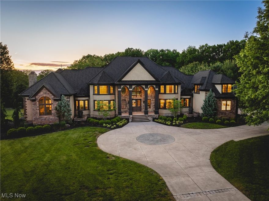 Situated on a pristine 3.34 acres on a cul-de-sac, this palatial, newly renovated French Country Estate will take
your breath away. Soaring ceilings and refined finishes coalesce to create an atmosphere of sophistication and elegance—
a perfect backdrop for both entertaining and everyday life. Throughout the home, sweeping windows and doors invite you
to step out to multiple stone terraces and patios that surround the home. Lustrous dark hardwood flooring flows
throughout the main level, and curved archways lead from the vaulted foyer into the formal dining room to the right, and
a relaxed lounge area to the left. A vaulted great room features a fireplace and sliding doors that open to a gorgeous sun
room that opens to a stone patio with a fireplace. The kitchen is a work of art, complete with rich leathered-granite
countertops, an oversized island, top-of-the-line appliances, and custom cabinetry. Two powder rooms, a laundry room,
and two bonus rooms perfect for home offices complete the first floor. Upstairs, there are 5 bedroom suites, including the
stunning primary suite, which includes a dream closet with an island, a resort-style bath, and a private covered terrace off
of the bedroom. All bedrooms have ample closet space, and two bedrooms have bonus loft areas. The party continues in
the lower level, complete with a family room with a kitchenette, a two-tiered home theater, a billiards room, and a guest
suite. Outside, the backyard oasis includes a sprawling heated pool and pool house, a large stone patio, and a 3+ car
heated garage.