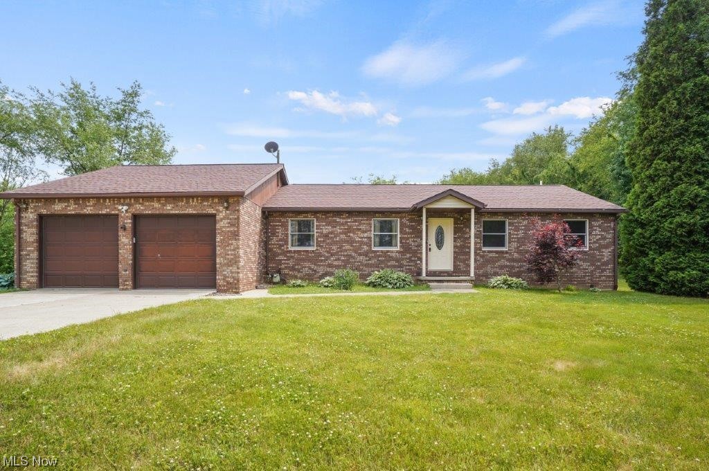 Welcome to your new address! This fantastic One Owner home features as much outside as it does inside! Outside you will find space to house 6 vehicles! Detached 3 car garage features a lift, an industrial air compressor and tire changer. One bay has a 12 foot door to store oversized vehicles. The attached garage features smart garage door openers. Inside you’ll find an open floor plan with large eat in kitchen. There is no lack of counter space here! The living features an electric fireplace and the family room features wood burner. The finished basement offers not one but TWO rec rooms and a full bath! The office is located here as well. The roof is approx. 2013, HVAC 96% spring 2022 (trane furnace and AC). Water tank 2022. New flooring in the kitchen and baths 2020. Smart garage door openers 2022 (attached garage is heated with water). This fabulous home has so much to offer! Call today for your private showing!