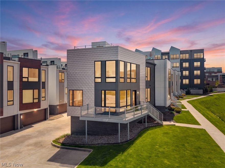 Welcome to 1250 W 70th Street—modern lakeside living at its finest. This stunning condo offers the perfect blend of sleek design, open-concept living, and an unbeatable location just steps from Lake Erie. From the moment you enter, you’re greeted by an abundance of natural light, wide-plank hardwood floors, and a thoughtfully designed layout built for both everyday living and effortless entertaining. The main level flows seamlessly from the spacious living room—anchored by a striking contemporary fireplace—into a beautifully designed kitchen featuring quartz countertops, a large waterfall island, and high-end finishes throughout. Expansive floor-to-ceiling windows on every level (excluding the entry level) flood the home with natural light and frame beautiful lake views, creating a bright and airy atmosphere throughout. Currently configured as a 2-bedroom, this home offers the flexibility to easily convert to a 3-bedroom with the addition of a sliding door, complemented by a built-in Murphy bed for added functionality. Upstairs, the primary suite serves as a true retreat, complete with oversized windows, serene lake views, a spa-like en-suite, and a custom-designed closet. At the top, your private rooftop deck offers panoramic views of Lake Erie—an ideal setting for morning coffee, sunset unwinding, or hosting guests, enhanced by a built-in speaker system. Additional highlights include attached garage parking, low-maintenance living, remote-controlled blinds throughout, a speaker system on the main level and rooftop terrace, and a tax abatement with approximately 7 years remaining—providing significant long-term savings. Located just minutes from Edgewater Park, Gordon Square, and downtown Cleveland, this home delivers the perfect balance of vibrant city access and quiet, lakeside living. Modern, move-in ready, and set in one of Cleveland’s most desirable lakefront pockets—this is one you don’t want to miss.