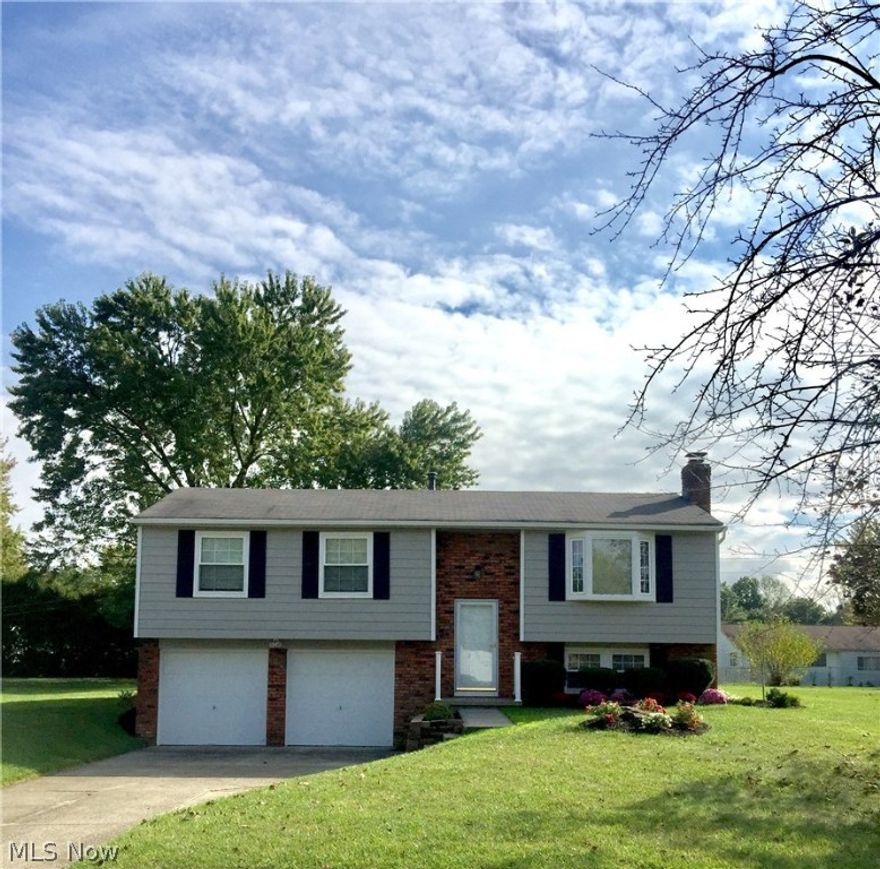 Beautiful Home! Completely updated inside and out! Both interior and exterior have been freshly painted with warm neutral tones! 
Aluminium sided 3 Bedrooms 2 Baths (1 full and 1 half), foyer entrance, kitchen with granite countertops. appliances stay - refrig, stove, dw, dining room with newer slider doors to a fabulous cedar deck with views of a landscaped, parklike backyard with shed, living room with laminate flooring and bay window, family room with fireplace and half bath, laundry room with washer and dryer and stationary tub, attached larger 2 car garage with work benches, electrical and automatic garage door openers, minutes from Metro Parks, shopping, I-71, schools and Cleveland Hopkins Int'l Airport!
Recent updates within the last year include: Newer A/C, hot water tank, windows, carpet, flooring, countertops, concrete front steps, window trim, electrical, plumbing, newer laundry room, .... and so much more!!!