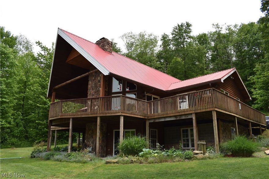 Offering over 4,800 square feet of space including four bedrooms and three full baths, a large eat-in kitchen and a great room with two-story stone fireplace framed by huge windows that let in tons of natural light. The first-floor master suite has a private bath, dual walk-in closets and exits onto the deck. A second bedroom, full guest bath and convenient laundry room rounds out the main floor. Upstairs, a large loft with a private balcony makes a great fourth bedroom, playroom or home office. Head downstairs and you will find a walk-out basement with an oversized bedroom, full bath, large wet-bar, storage and rec room with a second stone fireplace. Enjoy your morning coffee at sunrise on the wrap-around deck overlooking the fully stocked pond or evenings fishing and entertaining family and friends around a fire in the outdoor kitchen. The remainder of the property is wooded with great access from well-maintained ATV trails and holds fantastic deer and turkey populations. Additionally, there is a detached two-car garage with loft storage and a large heated shop with 18-foot ceilings, mechanics pit and attached finished living area that’s perfect for the serious gear-head or would make a great home shop and office to run a business. No expense was spared when building this Alaskan style lodge and it is now ready for you to love and enjoy just as much as the original owners. Call today to learn more and to schedule a time to see this stunning secluded retreat for yourself!