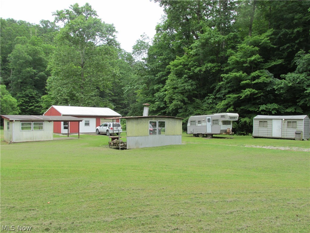 This 94.25 acre property is a perfect get away or you could live there all year around. This 30X24 pole building has a full bath, kitchen, and large living and sleeping area. There is a water well, septic system, free gas, land line phone, and 100 amp electrical service. Plenty of timber on the property and hunting is great. Small creeks run through the property and there are plenty of meadows too. Only 10 minutes from town out Turkey Run. Mineral rights do not convey.