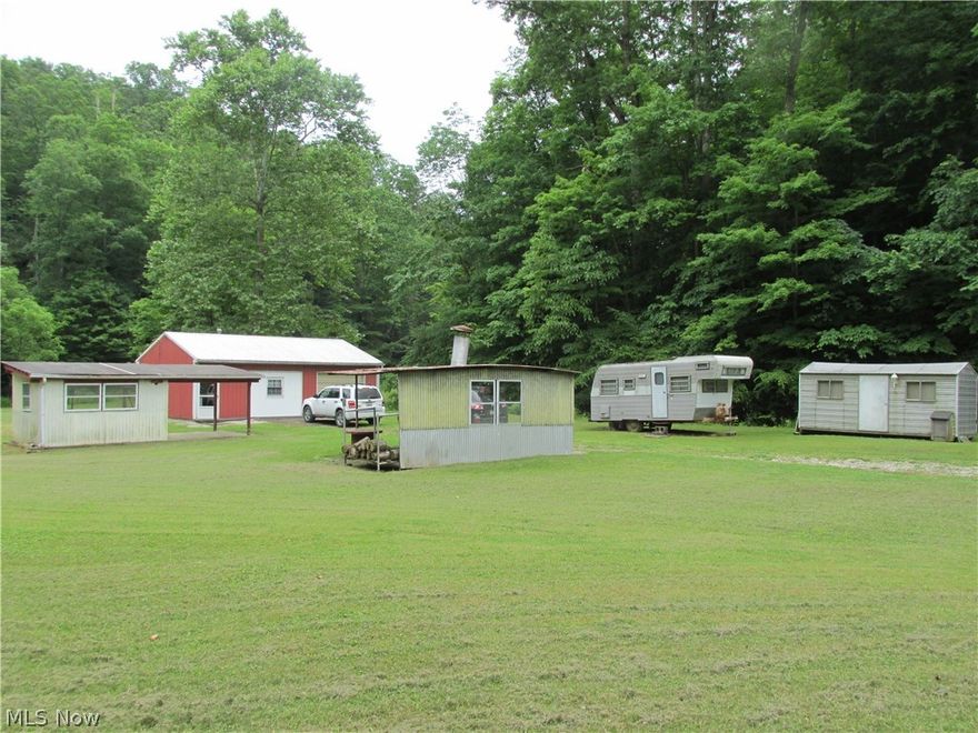This 94.25 acre property is a perfect get away or you could live there all year around.  This 30X24 pole building has a full bath, kitchen, and large living and sleeping area.  There is a water well, septic system, free gas, land line phone, and 100 amp electrical service.   Plenty of timber on the property and hunting is great. Small creeks run through the property and there are plenty of meadows too. Only 10 minutes from town out Turkey Run.  Mineral rights do not convey.