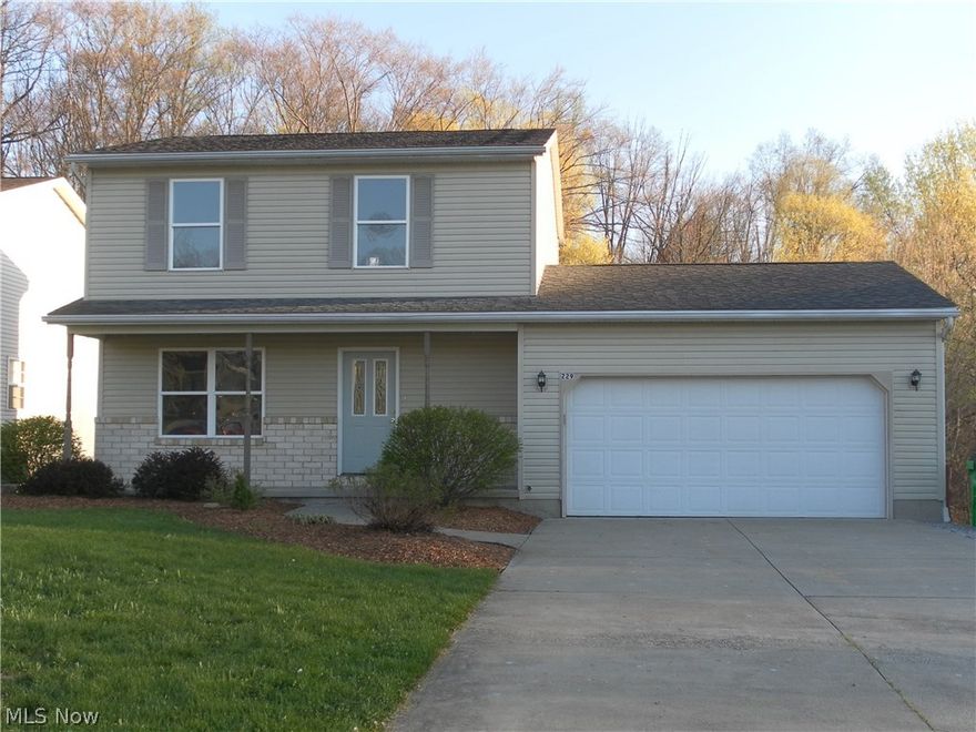 Move right in.  Freshly painted, new carpet, all appliances stay.  Eat in kitchen over looking back yard, large deck and wooded lot behind property.  Basement is perfect for entertaining, deck access through basement.