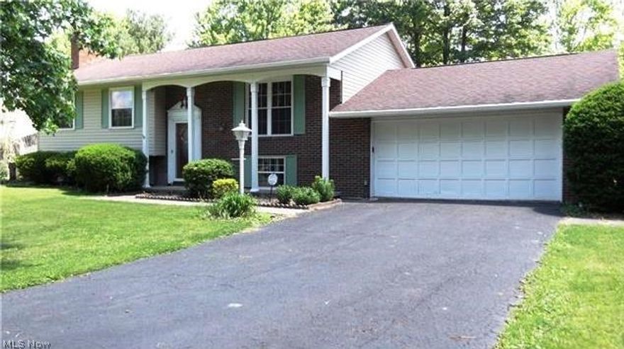 This lovely home has replacement windows, updated kitchen, bath, roof, siding, spouting and sump pump. Walls have been freshly painted and new carpet on the first floor. All interior doors have been replaced and lower level bath updated. Water softener has been replaced. Kitchen is fully appliance. This home is ready to move in and enjoy. Deck on home has a roof over it and a patio on the lower lever. Back yard is fenced. Storage shed will remain.