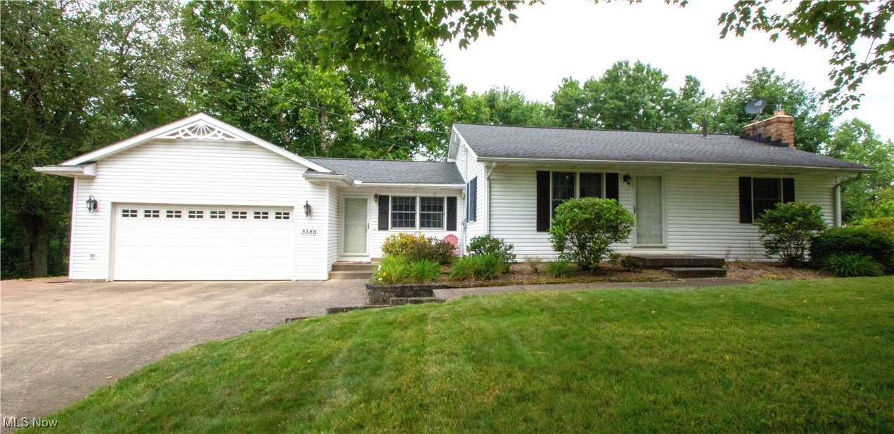 City Living with Country Space! Rare opportunity—two parcels combine for a total of 4.5 acres right in the city! This beautifully updated 3-bedroom, 2-bath ranch offers the perfect blend of comfort and convenience, with a spacious backyard deck overlooking serene, park-like grounds. Inside, you'll find a full-applianced kitchen, formal dining room, and cozy family room with a gas fireplace—ideal for chilly evenings. Hardwood floors gleam in the bedrooms, complemented by newer carpet in the living room and easy-care laminate throughout the rest of the home. A stunning oak staircase leads to the walkout basement, featuring a versatile bonus room perfect for a home office or guest space. Additional perks include two garden sheds, a heated garage, newer roof, Anderson windows, washer & dryer and newer furnace and central air for year-round comfort.. This one checks all the boxes—and with acreage like this, it won’t last long. Schedule your showing today!