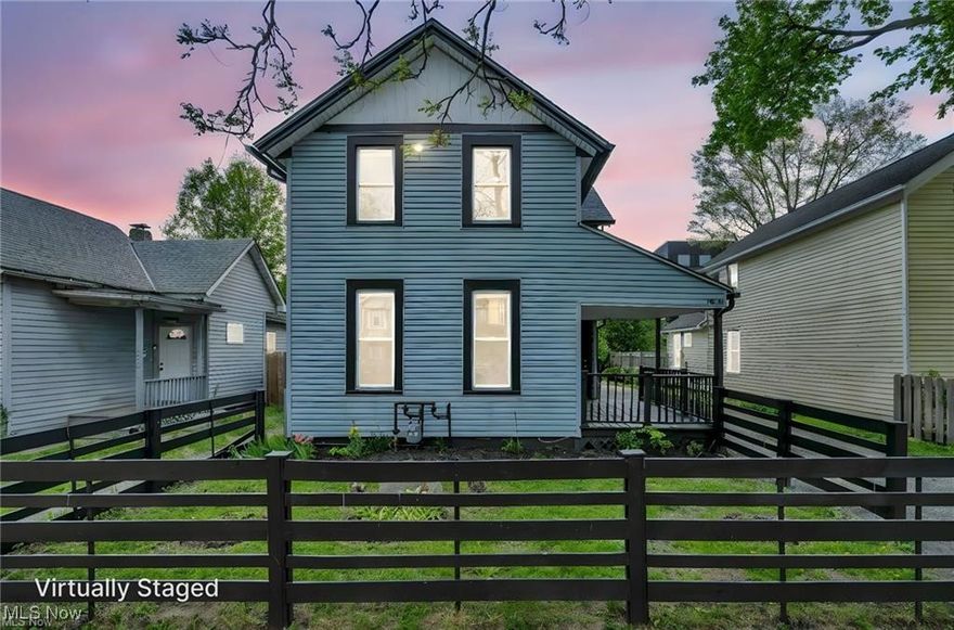 This beautifully renovated colonial in Tremont blends modern touches with unbeatable downtown views, visible from the backyard and the expansive primary suite. Step inside to find a spacious living room with luxury vinyl flooring that continues into a generous dining area—ideal for entertaining. Off the dining room, a massive first-floor bathroom impresses with dual sinks, a smart mirror, porcelain floors, and a tiled shower/tub combo. The updated kitchen includes granite countertops, a skylight, tiled backsplash, and access to the deck through sliding glass doors. A sizable first-floor bedroom offers ample closet space and flexibility for guests or a home office. Upstairs, you'll find three large bedrooms, including the show-stopping primary suite with a panoramic 60” window and en-suite bath featuring sleek porcelain finishes, a glass-enclosed shower, and smart tech. Recent upgrades include a high-efficiency furnace, A/C, hot water tank, and stylish lighting throughout.