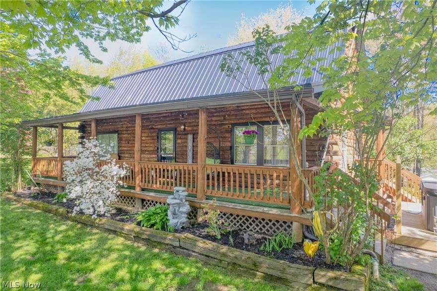 4897 Chestnut Drive is the kind of property buyers wait for -- a true cabin-style retreat tucked on over 2 private acres located in desirable Sherman Wood Estates in Brimfield Township. Set on a hilltop with a long wraparound private driveway, wooded property lines, and peaceful scenery, this move-in ready home blends rustic character with modern updates while offering over 2,600 square feet of living space, a cozy fireplace in the living room, 5 bedrooms and 3 full baths. Inside, you'll find warm, inviting living spaces, exposed beams, a renovated kitchen with updated stainless steel appliances that stay, updated bathrooms, newer LVP flooring throughout, fresh paint, and a flexible layout designed for both everyday living and entertaining. 4 bedrooms are on the upper level and 1 is in the basement, with a full bath located on all 3 levels. The walk-out basement adds incredible versatility with a spacious rec room/flex space, walkout access, and a fifth bedroom perfect for guests, an office or home gym. Enjoy quiet mornings on the inviting and expansive covered front porch, summer days by the 28-foot-above-ground pool with a deck and evenings relaxing on the side deck overlooking the property. An oversized 3-car garage (24x40ft/960sqft) features a tandem-style access with dual overhead doors for added convenience and functionality. Major improvements include newer septic, well pump, water softener system, propane tank, metal roof, electrical panel, basement propane heater, paint and flooring, light fixtures, and much more offering peace of mind for years to come. The property includes a storage shed, chicken coop with fencing and scenic outdoor spaces that make this home feel like a private getaway while remaining conveniently located near KSU, I-76, shopping, and dining. Field LSD. Properties offering this level of privacy, character, and acreage rarely become available!