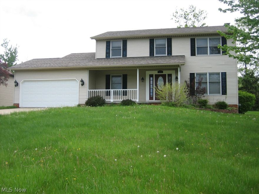 Do not pass up this updated, four bedroom, two and a half bath Colonial with an inviting front porch.  You will be greeted by a grand two story foyer with hard wood flooring.  Formal dining room and updated kitchen with granite, ceramic tile flooring and trendy back splash.  First floor laundry and half bath off kitchen.  Eat in kitchen flows to family room.  Family room features ceiling fan and cozy fireplace, perfect for all types of weather.  Large deck in back yard off of family room.  Elegant french doors lead to what could be a formal living room/office/den.  Master bedroom features large, walk in closet and full glamour bath with jetted tub, sit down shower stall and granite counter tops.  Full, unfinished basement with high ceiling and glass block windows.  Not a typical bank owned!