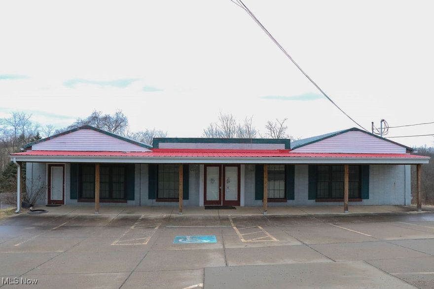 Former doctor's office and retail business with tons of possibilities! High traffic road in St. Clairsville. Medical exam tables and other contents can stay with the property. Parking for at least 8 cars by the entrance as well as extra parking in the back. Lower level has 2 apartments. 24-hour notice required for showings.