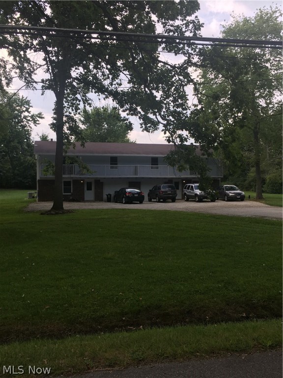 Nice opportunity in a great location. This well-cared-for two (2) unit offers nice size rooms, separate utilities, attached middle garages with lots of parking spaces on a level lot. Some of the updates in last two years include vinyl windows, furnaces, light fixtures, central air units, hot water tanks, insulated garage doors, screen doors, slider doors, carpeting, vinyl flooring, refrigerators, CO and smoke detectors hard-wired in, downspout lines and drains, and freshly painted throughout. Property has been converted to forced air gas heat. One of the sheds is brand new. Room measurements: Living 12x17, kitchen 15x12, master bedroom 11x14, 2nd bedroom 11x10, family room 11x18, and utility/laundry 14x19 each side. Nice enough to easily live in one side and immediately rent out the other. Appliances include 2 refrigerators, 2 stoves, 2 dishwashers, 2 central air units, 1 water softener, and 1 sump pump. Brick, block and cedar sided exterior. Upper wood deck measures 69' x 4' with