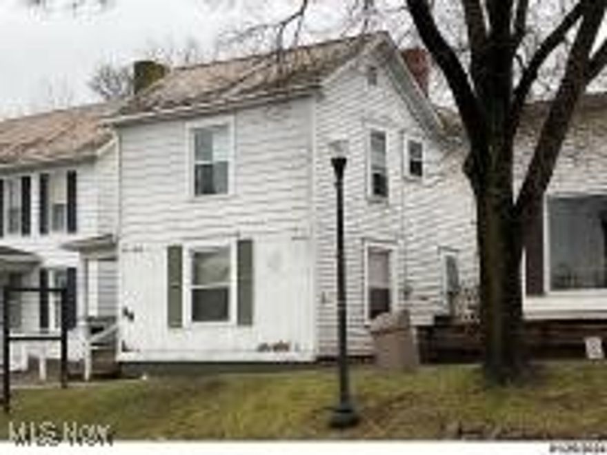 Realtor Owned Good investment property! Gas furnace and central air. Some newer windows. Downstairs is for commercial use. Upstairs is grandfathered in for an apartment. 1 bed, 1 bath with washer and dryer hook up upstairs.