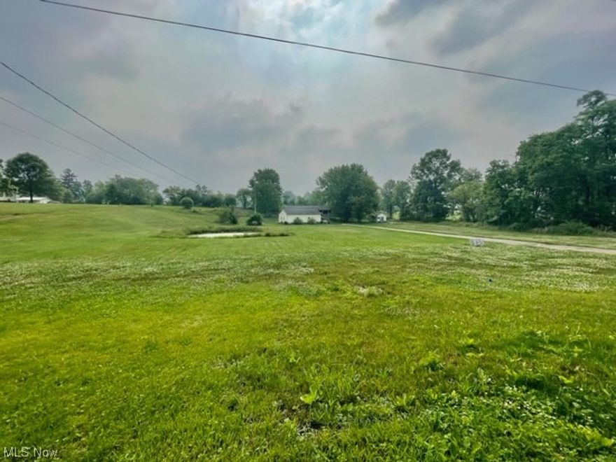 Scenic country land for sale located in the quaint village of West Farmington. 2.34 acres with 2 car garage and shed. Public water and sewer available. Property has been recently surveyed. House fire so current structure needs removed. Small pond.  Wonderful spot to build your dream home in the country!