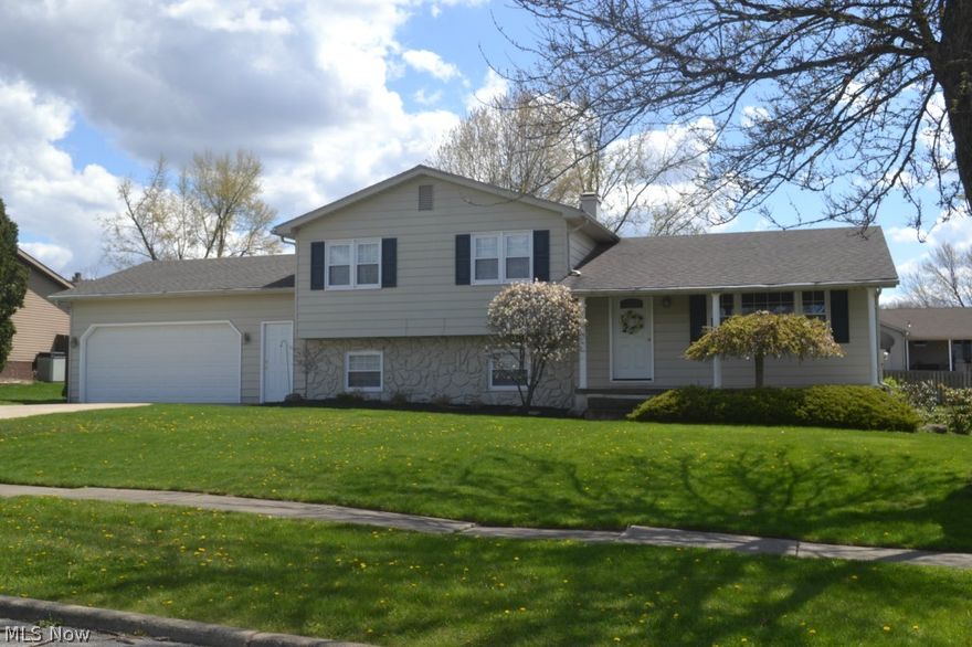 Take a look at this TERRIFIC four-level split home nicely situated on a large lot on a quiet, dead-end street. The main-level provides a formal living room, dining room with access to the deck and an updated kitchen with ceramic tile flooring and plenty of cabinet & counter space. Three bedrooms and a  renovated bathroom complete the upper-level. A family room with new carpeting, another full bath and an office are on the lower-level.  And don't forget the basement with it's separate laundry area, storage space and a rec room/game room area. The backyard is perfect for entertaining with its multi-level deck, patio and huge yard. Updates include roof (2007), driveway (2007), furnace/ac (2012), deck (2011) and H2O tank (2010). The home has it ALL - style, space and location.