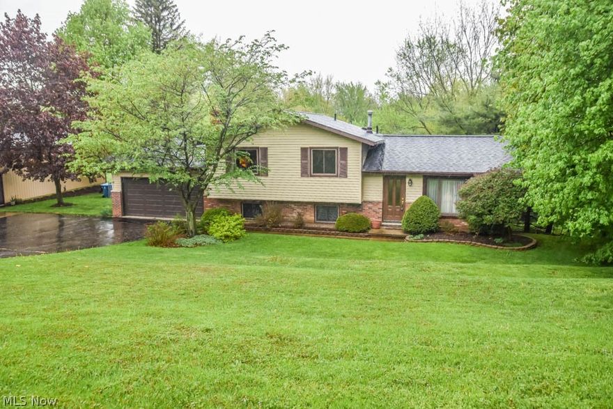 Well maintained 3 bedroom, 2 full bath 4-level split with a walkout basement on over 1.7 acres! Heated 24x48 pole building offers 12 ft ceilings, a rear door and access to water. Inside the house, prepare your favorite dishes in the applianced kitchen with a storage closet and a dishwasher. It opens to the dining room with sliding doors to the back deck. Spacious living room includes a coat closet, new front door and picture window. Upstairs, there are 3 bedrooms and a full bath with a linen closet. The master bedroom has direct access to the full bath. Downstairs, the huge family room has been redone with drywall, trim and a lovely fireplace with a woodburning insert. There’s a second full bath with a tiled shower, tile flooring and updated vanity. Walkout basement with glass block windows and laundry hookup - washer and dryer included! 2-car attached garage with a newer opener (2018). Outside, enjoy serene views from your tiered back deck and patio! Beautiful acreage in a convenient