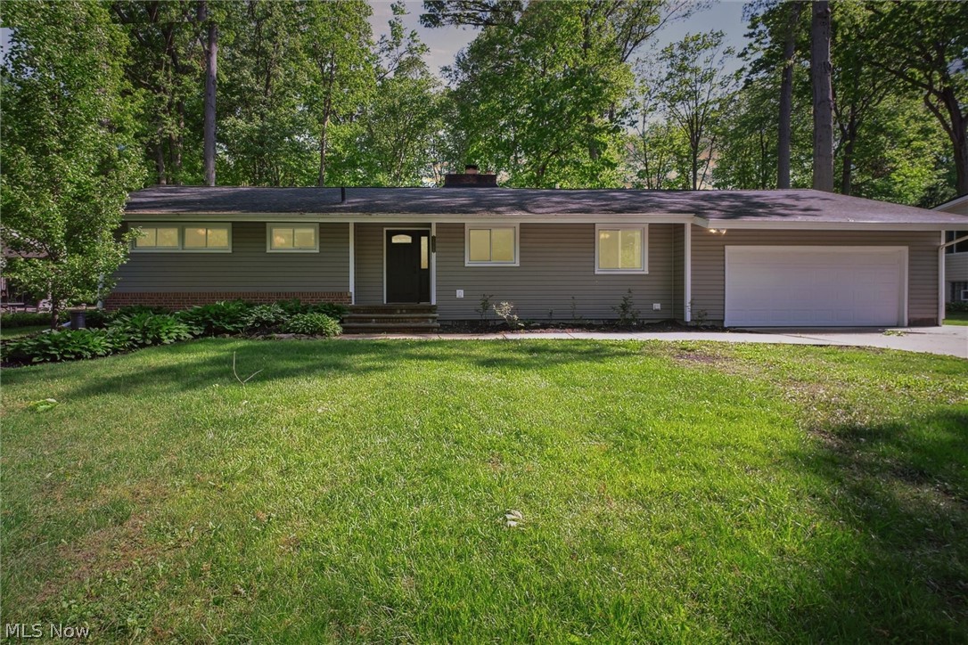 Wow! This well cared-for ranch has all the updates you are looking for and then some! Located in the amazing city of Avon, just minutes from everything, but on a quiet street with a beautiful park-like setting. This home has so much to offer and is just waiting for you to make it your own. The home features a spacious eat-in kitchen with solid wood cabinets, granite countertops and stainless steel appliances. The kitchen opens up to the living room which has a large window and sliding glass doors giving you amazing views of your tranquil backyard. A wood-burning fireplace with mantle and stonework, and updated light fixtures finish off this lovely room. You will delight in the private master suite that offers, a walk-in closet and an updated full bath with tiled shower and vanity with a granite countertop. The expansive deck can be accessed from the master suite as well as the living room allowing you to truly enjoy the serene backyard. The main bath features a HUGE custom vanity with granite countertops and tiled shower! There are 3 more generously sized bedrooms with large closets that round out the first floor. The finished basement is a great place to relax, but also has lots of storage as does the entire house. The attached 2 car garage adds ease and convenience and also features a newer gas heater! Woods line the back of the yard which give you a combination of privacy and beautiful views. Other updates include extra wide driveway, vinyl triple-pane windows, vinyl siding, added insulation, updated electrical and central air!! Call today for your private tour!!