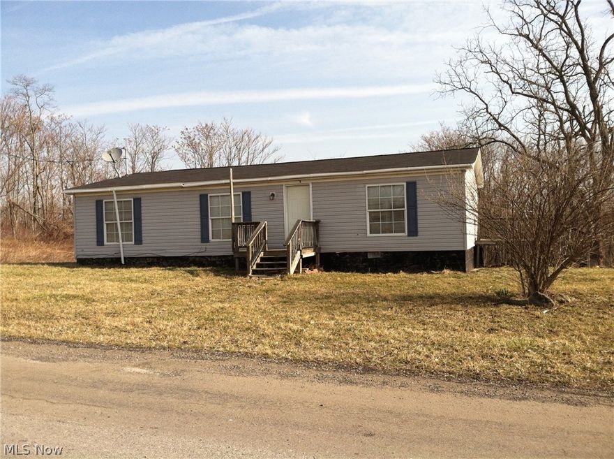 Great get-away or home to live in! 7 plus acres approx 3/4 wooded to Bow hunt etc in a great wildlife area. 3 bedroom 2 bath double wide that is in need of flooring and some updating. Offered in its AS IS condition. In quiet country on a smaller road but close to the main roads for easy access. If you are looking for affordable country living or a great get-away this could be the property for you! Any owned mineral rights will transfer!