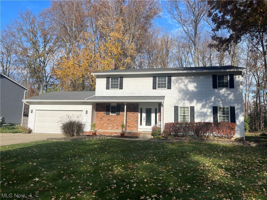 Bring your finishing touches to this lovely South Mentor colonial that’s ready for you!  Situated on a quiet street and wooded lot, this four bedroom colonial offers custom features that allow ease of living. The first floor boasts large and spacious rooms.  Upon entry, you will find an inviting foyer with plenty of storage, a tucked away powder room, which is attached to the laundry room - no more lugging laundry from the basement to the upstairs bedrooms.  It also boasts an inviting living room complete with French doors and beautiful entertaining options as it’s attached to the dining room.  In the back of the home, there is a large family room with a gas fireplace and sliding glass door that leads to the brick paver patio and beautifully treed back yard.  The kitchen is equipped with plenty of cabinetry, countertops and a separate pantry for your storage needs.  Upstairs, through a winding staircase, the four bedrooms sit comfortably much storage and two full bathrooms. The primary bedroom en suite has three closets for all of your clothing storage, a separate sink area, updated flooring near the walk in shower.  The other three bedrooms are spacious and also have access to the hall bathroom. The basement gives you storage or it could be built out for additional living space. The furnace was new in 2019, hot water tank in 2018, A/C in 2023.