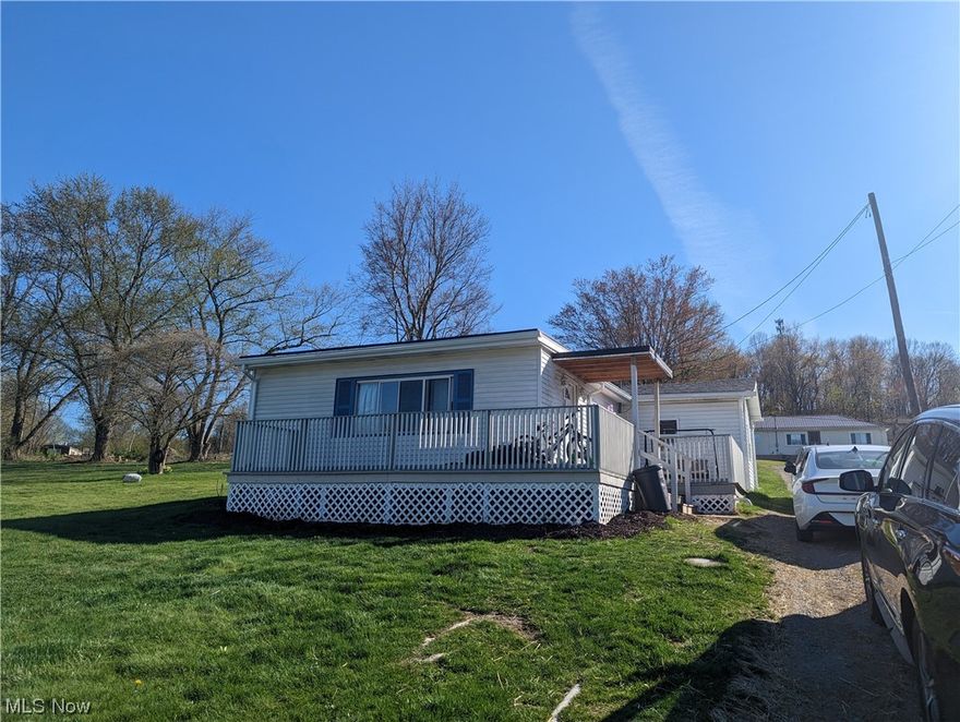 Check out this cute 1 level home in the heart of Calcutta.  There have been many updates, such as remodeled bathroom, new vinyl flooring, kitchen backsplash and main floor laundry room.  The washer, dryer and refrigerator are all less than a year old.  Enjoy the convenience of the pull through driveway and enjoy the quiet neighborhood from the front deck.  Affordable living in Beaver Local School District.