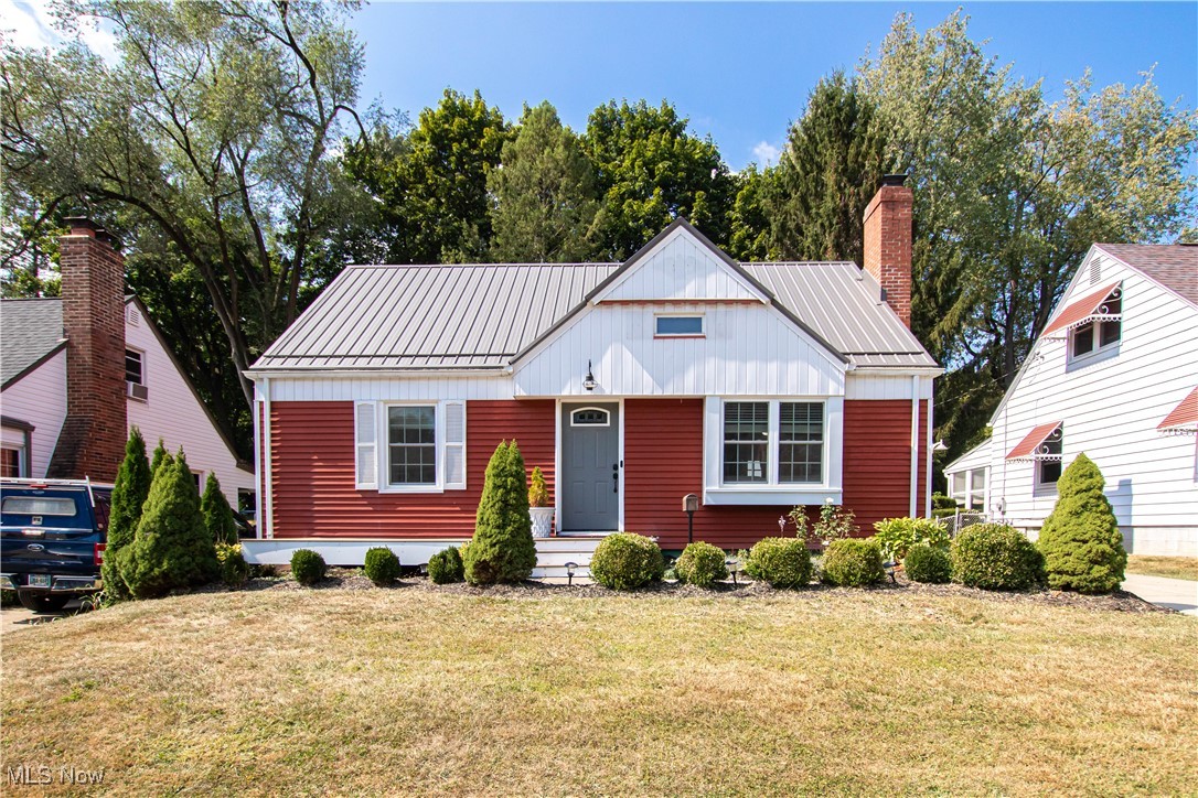 Welcome home to this beautifully updated Cape Cod in the heart of Cuyahoga Falls, thoughtfully enhanced with stylish finishes and modern amenities. The light-filled living room features a cozy fireplace and hardwood floors that continue through the two main-level bedrooms. The fully renovated marble bathroom offers a touch of luxury, while the remodeled kitchen showcases custom-built cabinetry and granite countertops. Upstairs functions as the third bedroom and is enhanced with abundant built-ins, a versatile office or flex space, and a brand-new split-level AC/heat unit for year-round comfort. Energy-efficient windows brighten every room, and the home also includes updated electrical wiring with Ethernet throughout — ideal for today’s connected lifestyle. Outdoors, enjoy a Trex front porch perfect for morning coffee, or retreat to the private backyard designed for entertaining and gardening. Features include a pea gravel patio, raised garden beds, firepit, and mature berry bushes. The rare two-story detached garage provides exceptional storage and hobby space. Additional updates such as modernized electrical systems, durable finishes, and thoughtful design choices ensure this home blends timeless character with everyday convenience. With its prime location near parks, schools, shopping, and quick access to Route 8, this Cape Cod is a rare opportunity to own a move-in ready home full of charm and functionality.