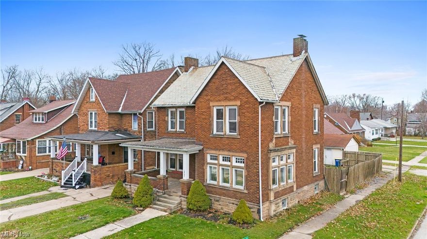 Welcome home to this beautiful, 3 story, classic brick colonial situated on a corner lot.  The large covered front porch welcomes you home after a long day.  Inside, the open feel is enhanced by the hardwood floors that flow throughout.  The living room is warm and inviting with large windows that cascade natural light and a cozy fireplace.  Off the kitchen, is a spacious room that can be used as a pantry or appliance storage.  Rounding out the main level are a separate dining area and an office / study.  Up the wood staircase to the second level, you will find 3 nice sized bedrooms, 2 with walk-in closets. As well as a large full bath.  Also you will find access to the third story, this space can be used as a bedroom, rec room or office space.  Completing this home, the full basement is partially finished with the second full bath.  The backyard is fenced, and accesses the detached garage.
