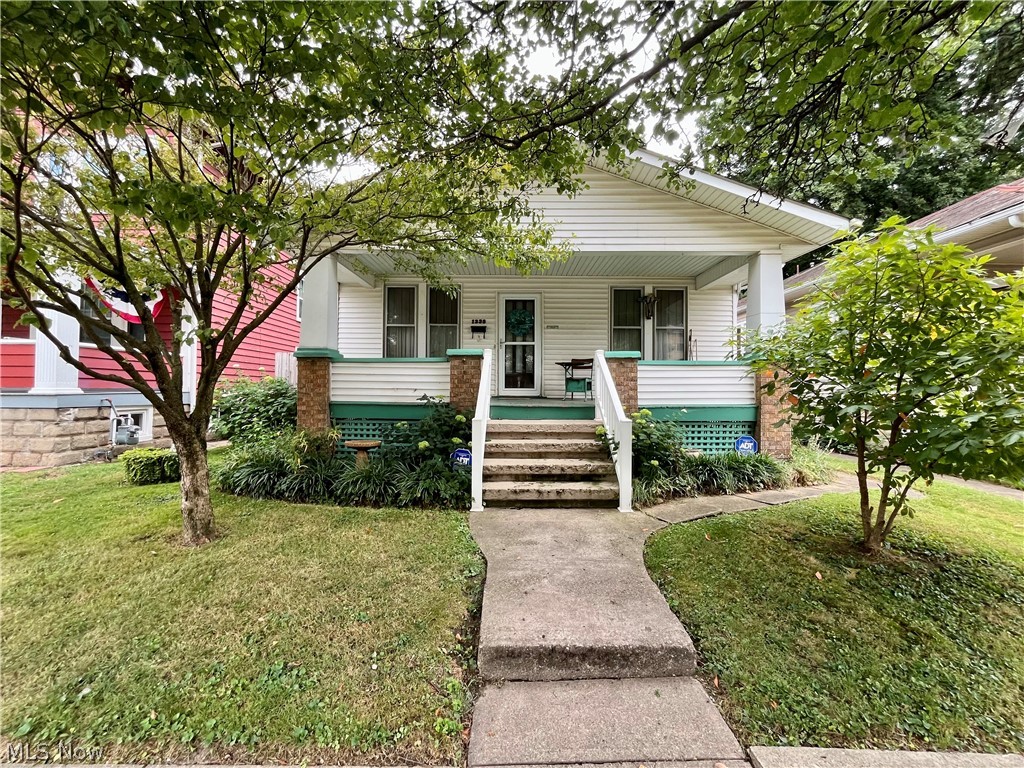 Welcome to this 2 bedroom, 1 full bath home w/detached garage. One "bonus" room could be bedroom #3, additional living space or a great office! Spacious living room & dining room. Some hardwood in the home & beautiful woodwork throughout. Although it needs some updating, this home has been well cared for. Range, refrigerator, washer & dryer will remain. Hot water tank was new in 2020, newer furnace & AC, newer wooden fence in back. Large front porch & peaceful back porch w/swing overlooking your private backyard w/many perennials makes this house a home. Priced to sell! Set up your showing today!