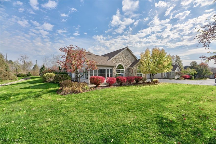 Welcome to this beautifully maintained ranch-style condo in highly sought-after Barrington Estates! This 3-bedroom, 2-bathroom home boasts soaring ceilings and a light, open-concept layout perfect for comfortable, single-floor living. Just off the kitchen, a dedicated dining space awaits for easy meals and entertaining. The cozy family room, featuring an enclosed glass fireplace, opens into a beautiful sunroom with walls of windows. Additionally, a lovely patio provides an inviting outdoor space for relaxing or gathering with friends. The kitchen has stainless steel appliances, gleaming countertops, and ample storage, creating a functional and stylish cooking space. A convenient main-floor laundry room with a utility sink and cabinetry sits nearby, along with direct access to a 2-car attached garage for easy entry and added storage. The tranquil owner’s suite includes dual vanities and a spacious walk-in closet, offering a private retreat within the home. Community amenities offer year-round recreation, entertainment, and practical perks like snow and trash removal, ensuring a low-maintenance, enjoyable lifestyle.