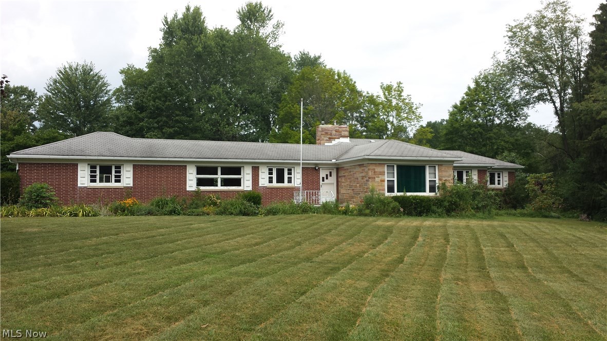 Beautiful lot with plenty of potential to turn this three bedroom/2.5 bath house into your dream home. Additional living space in basement with egress window perfect for children. Hot water heater new in Spring of 2015. Custom fireplace and exterior stone-work done by a skilled mason. Mature black raspberries, apple trees, blueberries, maple trees (previously tapped), grape vines and herbs. Bring inspiration and an open mind! More pictures soon. Pre-sale home inspection available to serious buyers.