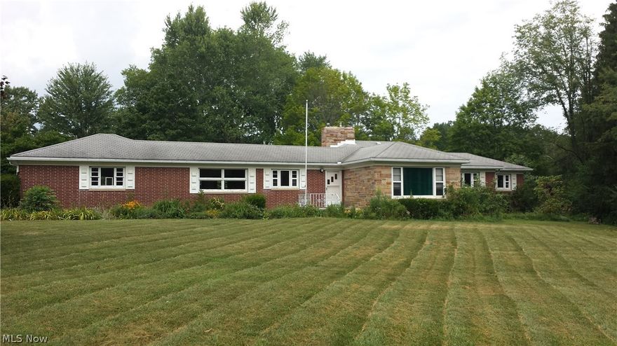 Beautiful lot with plenty of potential to turn this three bedroom/2.5 bath house into your dream home.  Additional living space in basement with egress window perfect for children. Hot water heater new in Spring of 2015.  Custom fireplace and exterior stone-work done by a skilled mason.  Mature black raspberries, apple trees, blueberries, maple trees (previously tapped), grape vines and herbs.  Bring inspiration and an open mind! More pictures soon. Pre-sale home inspection available to serious buyers.