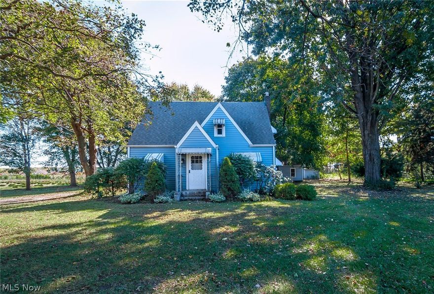 2.94 park like acres! Enjoy gazing at the stairs at night while relaxing in front of a fire in the backyard. This lovely bungalow has hardwood floors through out. First floor features a spacious living room, dining room, kitchen, 1 bedroom and half bath. Second floor features 2 spacious bedrooms, a full bathroom, ceder closet in hallway. Partially finished basement includes rec room, laundry room, workshop and shower & sink. There is also a 2 car detached garage. There is an enclosed back entrance. Kitchen appliances stay. Updates: Roof, gutters, windows, hot water tank all replaced in '06, garage roof replaced in '09. Home is located in Perry and uses 44077 zip code for mail.