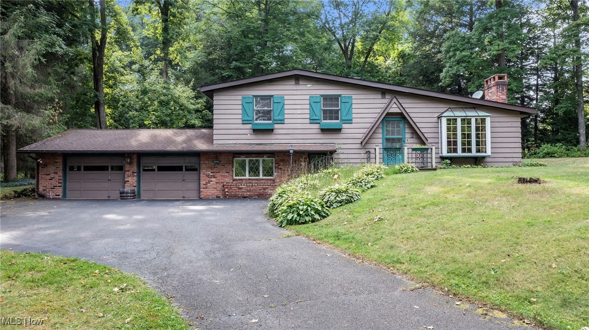 A beautiful home located in the center of nature at it's finest. To the east is property owned by the City of Akron. To the west is the Geauga park district you can hike, fish, bike. This home is nestled on a hill on a dead end street. Close to Burton Square and Punderson State Park.
Home has it's own private scenic pond. Two fireplaces one in the living room and one in the family room. Updated kitchen and baths. Rec rooms in the lower level with lots of storage. Whole house generator. Well regulator. And more. Unique offering. Make this beautiful estate your own.