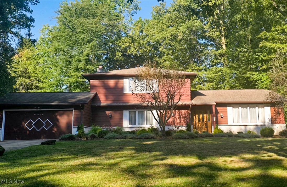 Oversized Split Level in Williamsburg Estates with updated Kitchen and Baths! Foyer with ceramic tile floors opens to the spacious Living room with vaulted ceiling and gleaming hardwood floors. Dining room with crystal chandelier is in classic "L" shape with the Living room for great entertaining flow. Remodeled in 2013 with custom Maple Amish built cabinetry, the eat-in Kitchen is certainly the heart of this home! With Center island with built-in wine fridge, Subway tile backsplash, Farmhouse sink and Stainless Steel appliances including a Bosch gas range plus double wall ovens, this Kitchen will inspire any Home Chef! Large Family room off the Kitchen is a perfect place for gatherings with brick hearthed fireplace and wet bar. Door in Family room opens to brick patio with newer gas grill that stays with the home, and private, park like backyard including a storage shed. Ample first floor Bedroom with updated Full bath could easily become a first floor Master or In-law Suite! Convenient first floor Laundry with access to two car garage. Upstairs Owners Suite has updated Spa bath with step in shower and separate dressing area with walk-in closet. Two additional large Bedrooms share updated Full bath in hall. Finished lower level has additional storage space. Newer hot water tank! Hardwood floors installed 2020. Kitchen Refrigerator 2 years old. Don't miss this special opportunity!