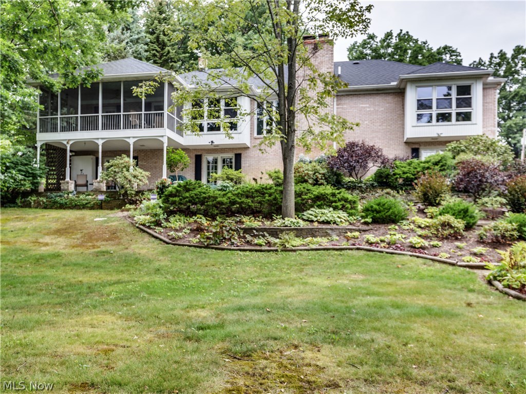 Lovely lake front brick ranch on main chain of Portage Lakes in City of Green with 4 bedrooms, 3 baths, 2016SF plus an additional 1000SF in finished walk out lower level, 123' on water (90' concrete sea wall 2005) in Turkeyfoot Heights* Open & airy floor plan* Entry with ceramic floor, crown molding & open to living room & family room* Family room with brick gas log fireplace open to dining room & spacious kitchen with breakfast bar, pantry, granite counter top, ceramic floor & fully applianced* Screened porch off dining room & kitchen with tranquil views of lake & landscaping* Master bedroom with window wall, sitting area & master bath* Guest bedroom or office with built ins* 1st floor laundry available (plus lower level laundry)* Walkout 12 course lower level recreation room, great for entertaining, with wood burning fireplace (gas starter & blower), wet bar, sound system, built in shelves & French doors to patio (lake side)* 4th bedroom (used as a craft room) with French doors to pa
