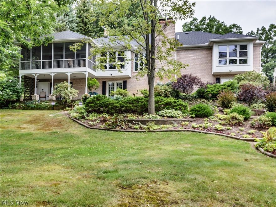 Lovely lake front brick ranch on main chain of Portage Lakes in City of Green with 4 bedrooms, 3 baths, 2016SF plus an additional 1000SF in finished walk out lower level, 123' on water (90' concrete sea wall 2005) in Turkeyfoot Heights* Open & airy floor plan* Entry with ceramic floor, crown molding & open to living room & family room* Family room with brick gas log fireplace open to dining room & spacious kitchen with breakfast bar, pantry, granite counter top, ceramic floor & fully applianced* Screened porch off dining room & kitchen with tranquil views of lake & landscaping* Master bedroom with window wall, sitting area & master bath* Guest bedroom or office with built ins* 1st floor laundry available (plus lower level laundry)* Walkout 12 course lower level recreation room, great for entertaining, with wood burning fireplace (gas starter & blower), wet bar, sound system, built in shelves & French doors to patio (lake side)* 4th bedroom (used as a craft room) with French doors to pa