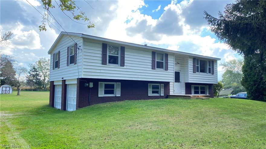 Welcome to this attractive home located close to Lake Erie. This home is a 3 bed, 1 bath home with a partially finished basement and has an attached 2 car garage. Not only is the home great but so is the yard with 1.14 acres of property!  Seller has had the exterior brick painted, outside shed painted and front deck put on. New hot water tank 2021. This home has only had ONE owner and it has been extremely well taken care of. Don't miss your chance to own this amazing home.