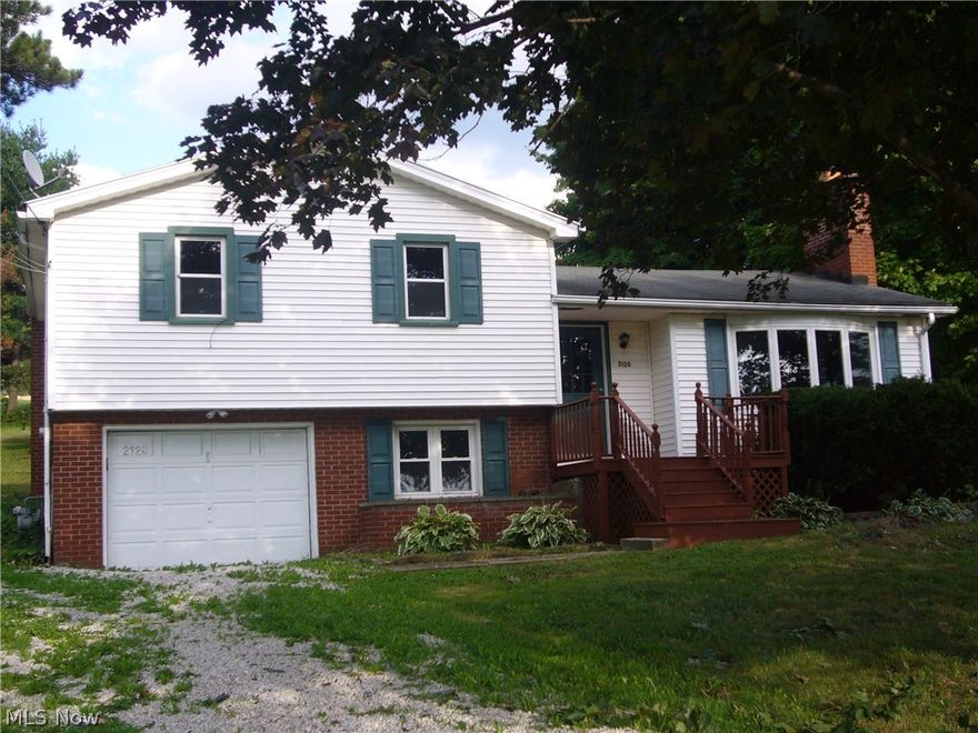 TOTALLY UPDATED 3 LEVEL SPLIT, with 3 bedrooms and 1.5 bathrooms, new kitchen & baths, carpet.  Home has a nice deck, circular driveway, newer replacement windows, glass block windows, bonus room 18 x 9, and a real bonus in a 2 story, 2 car detached garage.  Home comes with a one year renewable Home Warranty.  EASY TO SHOW!!!