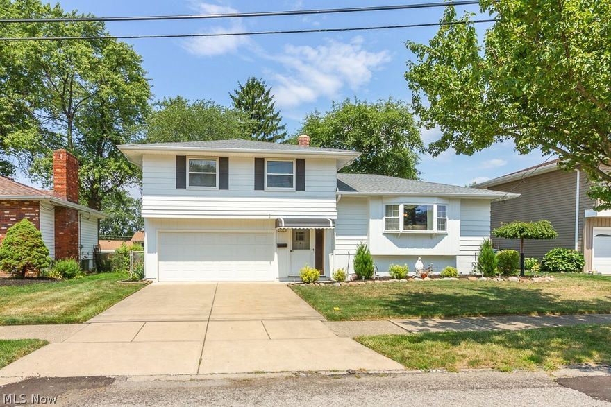 Move right in to this well cared for & nicely updated 3 Bedroom 1 1/2 bath split level home.  Enter through the front door into the large foyer & head up to the main level to living room & spacious eat-in kitchen featuring maple cabinets, recessed lights, tile backsplash, tile floors, built-in oven, microwave, countertop stove & movable island.  The upper level is complete with three spacious bedrooms with large closets & full update bath with title floor & wall surround.  The lower level family room is a great second living space & large laundry/utility room allows for additional storage & has a gas hookup for a 2nd oven.  The updated half bath located off the foyer is great for guest & is also conveniently located near attached garage that has direct access to the 23x13 covered patio overlooking the perfectly manicured fenced yard.  Additional features & updates include: vinyl windows, glass block, newer gutters, garage door & opener 2017, newer driveway, 8-10 year old architectural