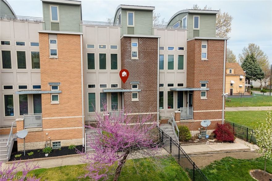 Nine year young townhome in the beautiful Parkside development near Rockefeller Park and University Circle!  If an open floor plan is your vibe, this place is for YOU!  Walking in the front door you'll enter the spacious living room w/laminate flooring, a dining area with access to a lovely patio -perfect for entertaining friends and family!  Kitchen is a nice size, fully applianced plus there's a 1/2 bath on the main floor as well!  Upstairs are two spacious bedrooms, walk in closets and the master has it's own full bathroom featuring bathtub with jets, shower and plenty of vanity space!  There's a second full bathroom on the second floor as well.  Laundry room conveniently located on the second level, also!  The best part of this place, is the roof top patio--perfect for enjoying some peace and quiet after a busy day!  There's also a finished space in the lower level that can be used as a family room, play area, office, or even a third bedroom-whatever you wish!  Garage is accessed f