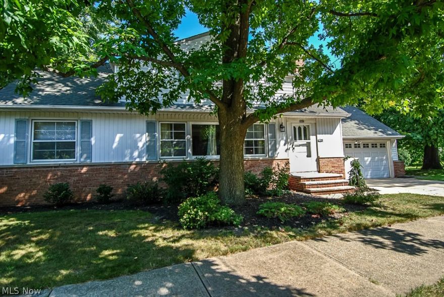 Located in a great neighborhood with a large side lot, this Cape is conveniently located near shopping, restaurants, a park, and within 1 mile of highway access.  A large family room with large crown molding joins the living and dining room to create a nice open flow as you enter from the foyer. A walk out patio from the dining room lead to a private patio. The foyer, kitchen, and downstairs first floor 1/2 bath has newer tiled floors. Other updated tile include the shower in the first floor full bath which sits adjacent to the master bedroom. Hardwood floors in the upstairs bedrooms, built in cabinets for storage, and plenty of windows for natural light help add to the character of this home. Downstairs is a full basement with half being finished for a play room for the kids or easily a nicely sized office. The attached 2 car garage has running water, drain, and a side access man door which make this great for those snowy winter months. Seller is motivated to sell and move so make an