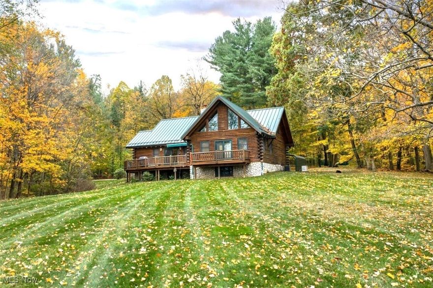 Secluded lakefront custom built log home with amazing panoramic views of Atwood Lake. This is one of the best lots right on the lake with its own private dock. It is situated at the end of a lane surrounded by woods and privacy. The home was built by Fairview Log Homes and has a great open floor plan with 4 bedrooms, 3 1/2 baths, a first-floor laundry room, and a finished basement. The living room has an impressive stone fireplace, cathedral ceilings, and patio doors out to a wraparound deck. The spacious kitchen comes equipped with all of the appliances. There is a first-floor master suite with a fireplace, a private bath, lots of closet space, and patio doors out to a private deck perfect to enjoy watching the sunset from. There is also a large loft bedroom that has its own private 1/2 bath. The basement has been tastefully finished with a family room, bedroom, and a full bath. There is also a large unfinished section for all your storage needs. There is a gas furnace with central air, 2 hot water tanks, 200-amp electric, and a Generac gas powered generator. Outside enjoy the built-in stone firepit, a 24x36 building that could easily be used as a guest house that has a 1 car garage and attached carport, and a shed for additional outside storge. The 2025 MWCD lease is 5853.00. This is truly a once-in-a-lifetime opportunity to own a property like this on Atwood Lake.