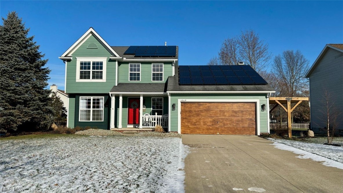 Located in Kent's popular Fieldstone neighborhood, this fantastic home boasts 3 bedrooms, 2.5 baths, and SOLAR PANELS! The inviting floor plan is modern and flooded by an abundance of natural light. The stylish kitchen is striking- with a white subway tile backsplash, white and brown two-toned cabinets and a large butcher block island/breakfast bar! Directly off of the eat-in kitchen is the family room with vaulted ceiling, skylights, and gorgeous wooden beams. The gas fireplace is a beautiful focal point with hidden tv storage. The wall of windows gives a fantastic view to the backyard and amazing shed and the sliding door gives direct access to the deck! Rounding off the main floor, you will find a formal living room, half bath, kitchen pantry, and laundry/mud room. Upstairs, you'll find a spacious owner's suite that features a walk-in closet and full bath. You'll also find two additional generously sized bedrooms and a full bath to share. One bedroom is currently being used as an office and has optional laundry in the closet. The other bedroom has a bookcase which hides a bonus room! The full unfinished basement provides plenty of storage and is a blank slate with endless possibilities. NEW IN 2023: FURNACE, A/C INCLUDING CONDENSER, WHOLE HOUSE HUMIDIFIER, and REFRIDERATOR! There's main floor and second floor laundry hookup options plus the home has a whole house attic fan. Conveniently situated near the hike/bike path and a park with sports fields. Move-in ready with a home warranty... what are you waiting for?!! Call TODAY before it is gone!