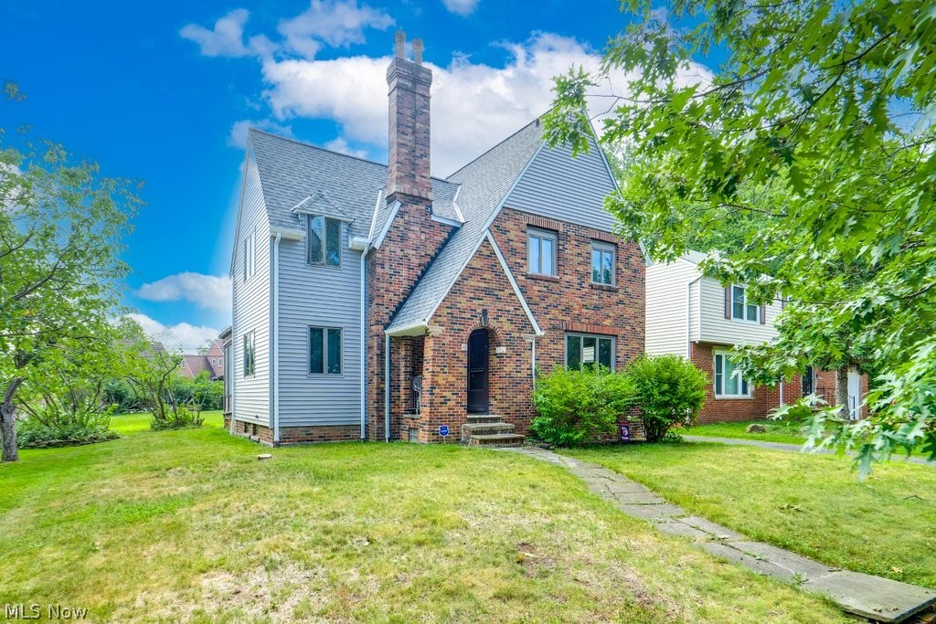 Welcome to this beautifully maintained 3-bedroom, 1.5-bath brick colonial nestled in the heart of Euclid. This home boasts timeless charm with modern updates, making it the perfect blend of classic elegance and contemporary comfort. As you step inside, you'll be greeted by a spacious living room featuring gleaming hardwood floors and a cozy fireplace, perfect for relaxing evenings. The formal dining room is ideal for hosting dinner parties and family gatherings. The remodeled kitchen includes a convenient breakfast bar, modern appliances, and ample cabinet space. Adjacent to the kitchen, the sunroom overlooks the serene backyard, providing a tranquil space to enjoy your morning coffee. A conveniently located half bath completes the main floor. Upstairs, the master bedroom serves as a spacious retreat with a charming fireplace, offering a warm and inviting atmosphere. Two additional bedrooms are generously sized with plenty of natural light and storage space. The full bath on the second floor has been updated with new flooring, ensuring a comfortable and stylish space. The partially finished basement features a rec room, perfect for a game room, or extra living space, along with a practical laundry and utility area that offers additional storage. Updates include: nature stone flooring in basement, new roof and vinyl siding in 2024 and new steam boiler installed in 2020. This home is a true gem, offering the perfect combination of character and modern amenities. Don't miss the opportunity to make this beautiful colonial your own. Schedule a showing today!