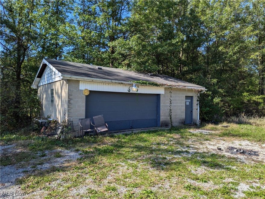 You'll love the privacy of this 12 acres in West Branch Schools. You need to take a walk through the mostly wooded acreage to truly enjoy it's beauty.  370 feet of frontage on Courtney Road. Ranch Home Has so much potential and would make a great project. First floor laundry and fireplace in the Great Room. Full Attic and full basement. 28x25 Garage gives you ample space to tinker. Selling as-is. Much upside potential. Gas heat and C\A. Take a look and walk the land today. Mineral Rights Transfer! Priced at less than 10K per acre!!!!!