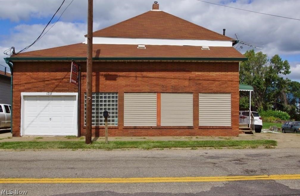 For Lease: Industrial first floor and lower level space. Zoned I-2. Space is approximately 2,350 sf and is located on .43 acre. The garage space with overhead door is not part of the lease. Restroom is part of the common space. There is a loading dock on the side of the building. Great space for a machine shop, metal shop, woodworking shop or storage space. Plenty of parking.