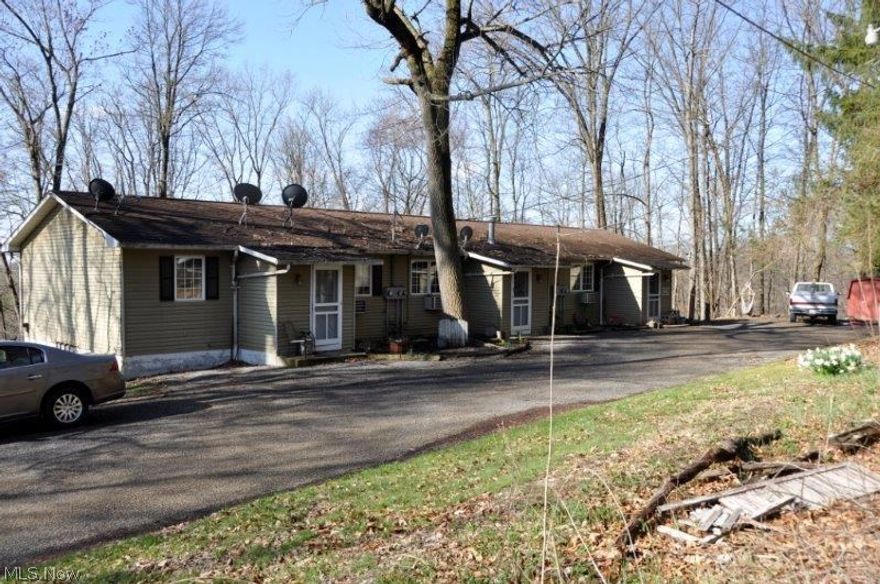Auction Saturday April 30th  2016
10:00AM
5 Units * 2 Bdrm/ 1 Bath  * 1.181 Acres * Wooded Setting
Walnut Creek Township * Holmes County * East Holmes SD
Good cash flow and full occupancy. If your cd is bringing in a whopping .25% it may be time to look into growing you real estate portfolio.  I’m pleased to have up for sale a 5-plex on the outskirts of Walnut Creek with a 1.181 acre wooded setting. Utilities are gas and electric (metered off separately) and well & septic.  Each unit features 2 bedrooms and 1 bath. Interior has been maintained and shows very well.