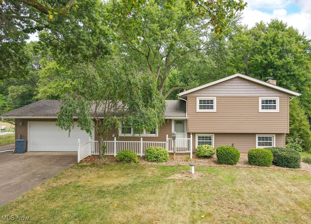 Beautiful 3 bedroom/2.5 bath split level on quiet park like setting. This home has so much to offer and more... hardwood floors, gorgeous gourmet kitchen with dishwasher, oven, gas cooktop, pantry and fabulous breakfast bar,a full newly redone mud room, large open living room and dining room with slider out to the beautiful serene backyard and oversized deck. The second floor includes 3 oversized bedrooms with a master suite with private bath, and the lower level includes a cozy rec room with fireplace walkout to a patio and a plethora of storage and a laundry area. The lower level also leads to a full basement for storage and that is rough plumbed for an additional bathroom. In addition, the home sits on a private lot with an oversized 2 car garage and fenced backyard and a whole house generator. All located in prime location and close to all amenities. There is also a brand new septic system and many updates. Call today for your own private showing.