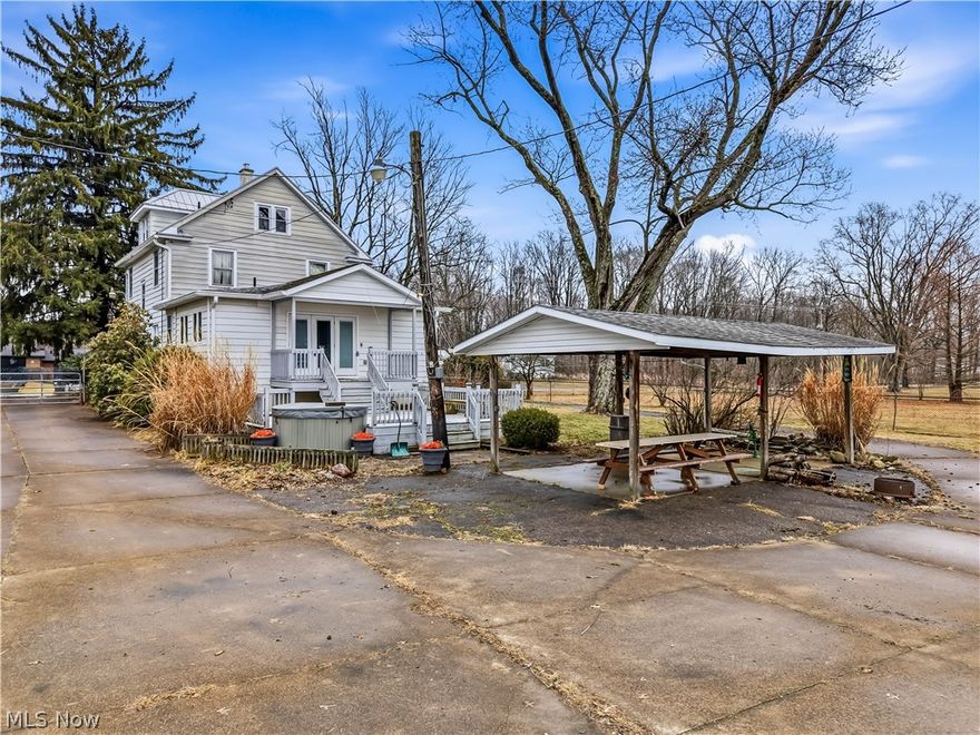 Welcome to the ultimate homestead! This exceptional property offers everything you need for a self-sufficient lifestyle or for hobbyists with 4-H projects and more. Grounds feature 5 fenced pastures and several versatile structures. Main barn includes 7 stalls w/a hayloft, dirt flooring and cement walkways, complemented by a covered lean-to with a concrete base. A 2nd barn features a one-car attached garage, upper storage, a feed room and two extra-large foaling stalls, plus two smaller stalls and a fenced in lean-to area. Frost-free water is available in both the barns and the middle pasture. Additional outdoor amenities include an 18-run dog kennel building, 8 are covered w/multiple play yards, three poultry pens, a wood shed and a dedicated smoker building. There is also a small barn previously used for pigs, 6-bay garage (3 bays are insulated with heat and openers), a large garden area w/established asparagus and onions, picnic pavilion, hot tub, koi pond and fruit-bearing peach and pear trees. Property is secured by a gated, concrete circular driveway. Interior of the home is equally impressive, featuring four bedrooms and two full bathrooms. The layout includes a family room with cathedral ceilings, living room, dining room with original woodwork and pocket doors, an updated kitchen with a pantry and first-floor laundry room. The first-floor bathroom is a private retreat equipped with sauna, steam shower and heated floors. The recently finished 3rd  floor offers flexible space for a primary suite or game room or more, while the full basement includes a wine cellar, canning area, herb-drying station and tankless HWT.  Key updates include: 2025- New family room flooring and finished third floor, 2020- New furnace, A/C barn roof, and most windows (75%) Located in the desirable Marlington School District, this property offers a peaceful country setting with convenient access to Alliance amenities as well as an easy commute to large cities via Routes 62 and 77