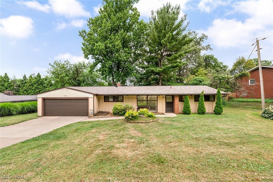 Welcome home to this charming 3-bedroom, 1.5 bath ranch in Fairlawn! One floor living at it's best. This inviting home features large windows in both the living and family rooms that fill the space with natural light, creating a warm and welcoming atmosphere. You'll love the beamed ceilings throughout and enjoy the eat-in kitchen, and a separate dining room - all perfect for both everyday living and entertaining. The large, beautiful yard offers plenty of space for relaxing, gardening, or outdoor gatherings, while the attached 2-car garage adds convenience and extra storage. An extra bonus: new roof! This home is just minutes from shopping, parks, and more. Don’t miss your chance to own this lovely home in a desirable location!