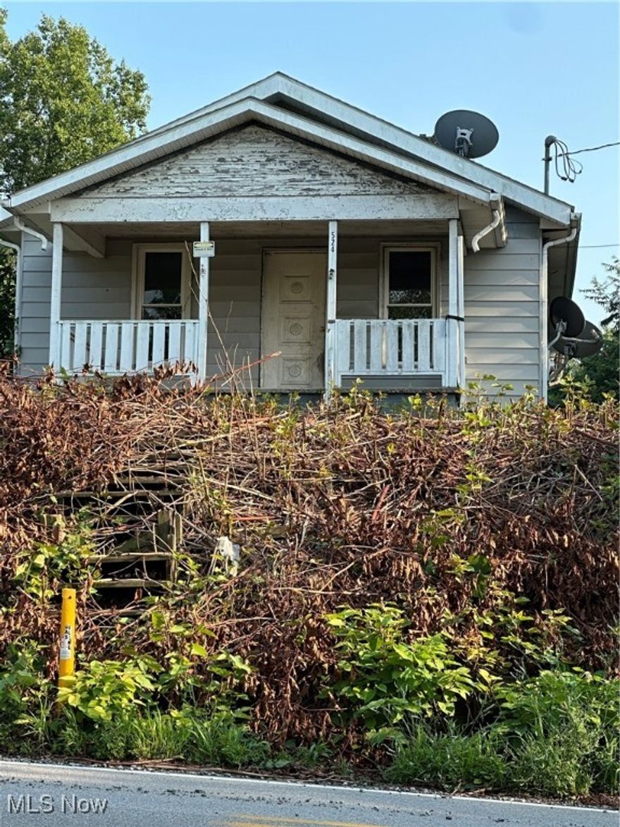 This classic Bungalow in Chester, WV in need of restoration is waiting for!! This property has a nice open single floor layout, large city lot and 2 car garage. It could be a great investment property or family home!! Property is being offered "AS IS" Schedule a tour today!!